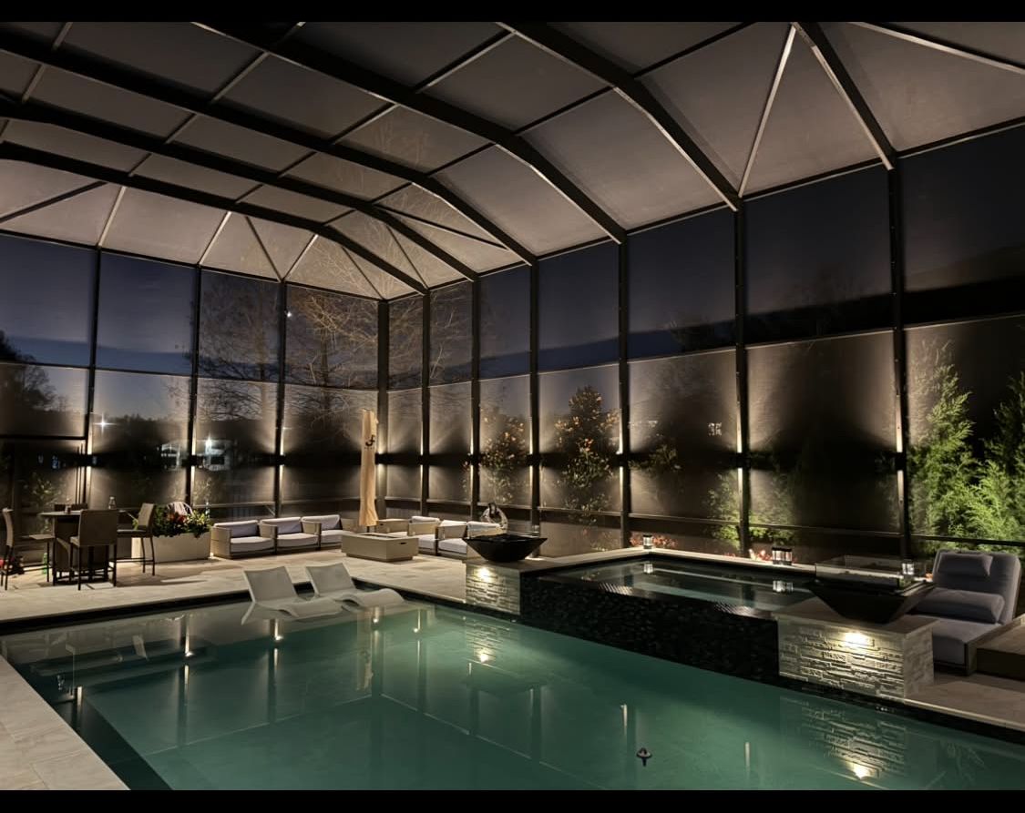 Pool deck with side perimeter wall LED lighting at night