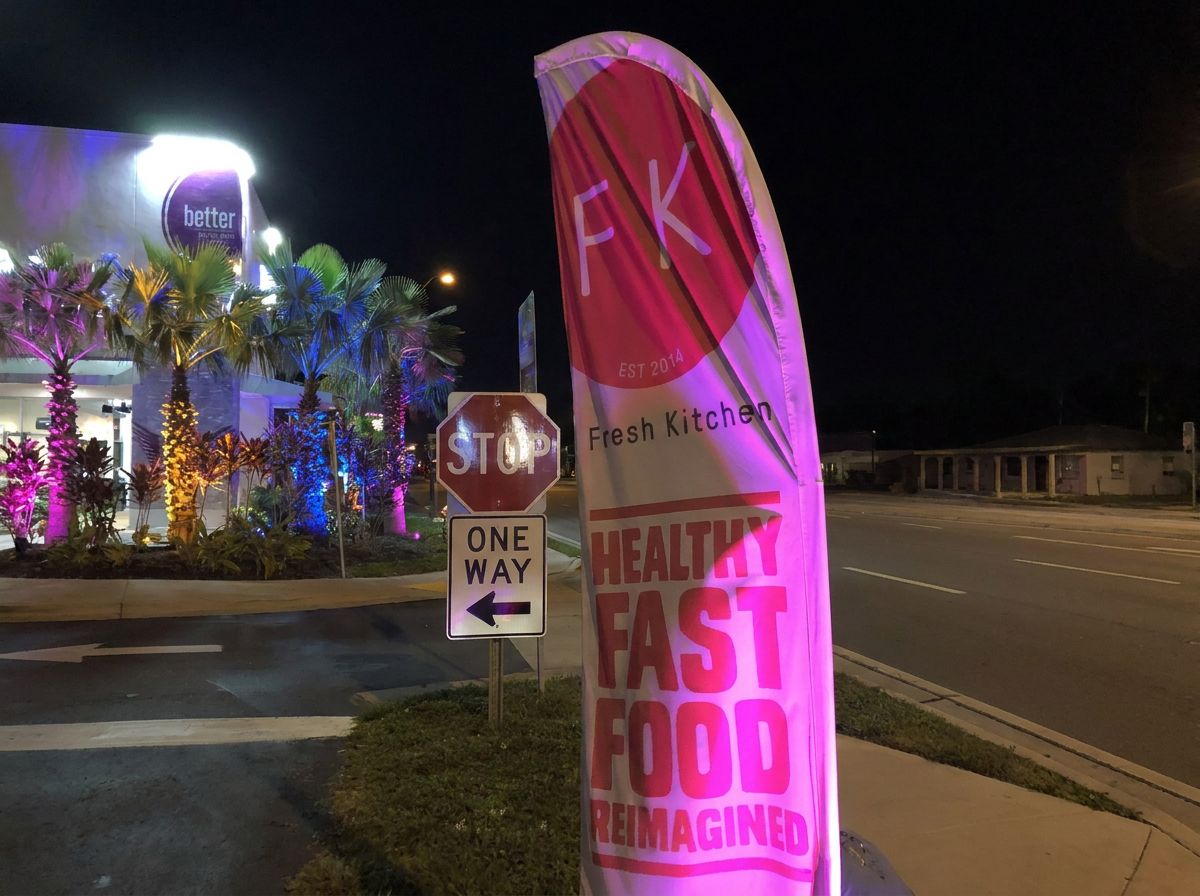 Fresh Kitchen Tampa restaurant exterior green RGBW LED lighting and magenta sign at night